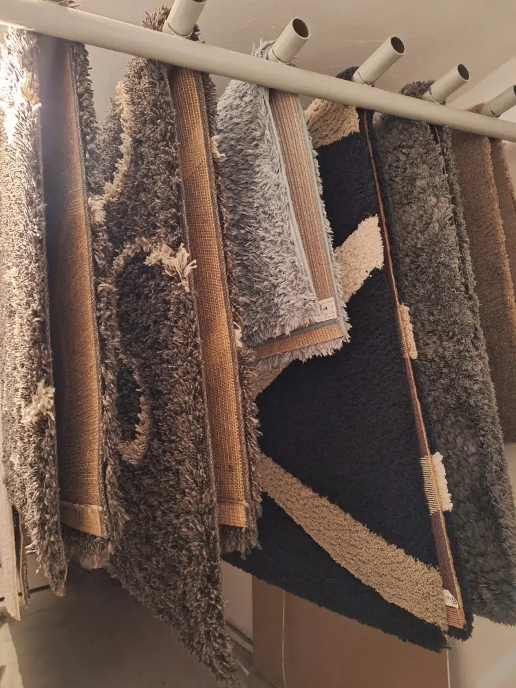 carpets on a rack
